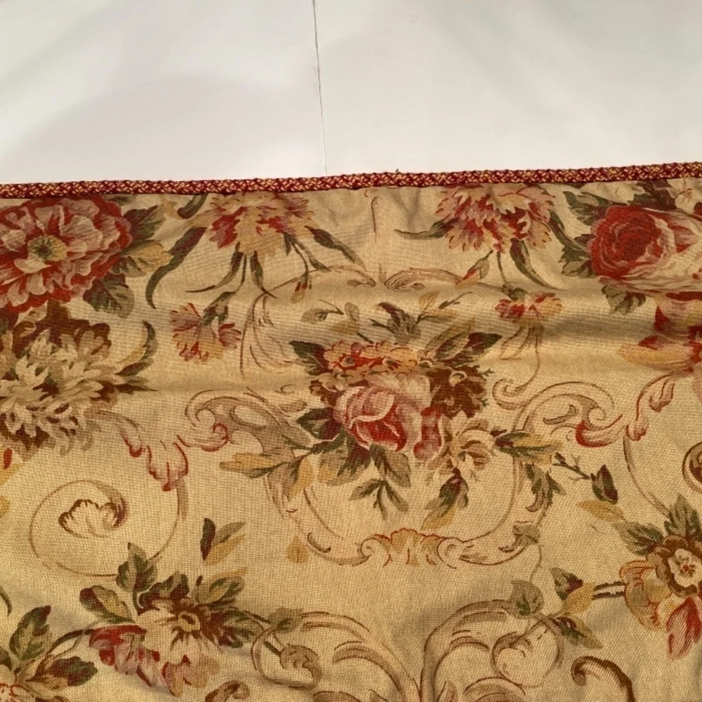 Red and brown pillow covers with zipper and cording. 35” wide 15” depth.